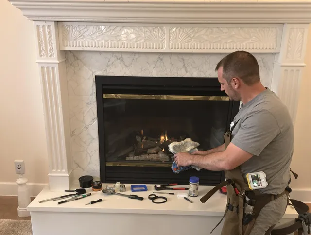 Central Falls Chimney Sweep performing fireplace maintenance in Central Falls, RI